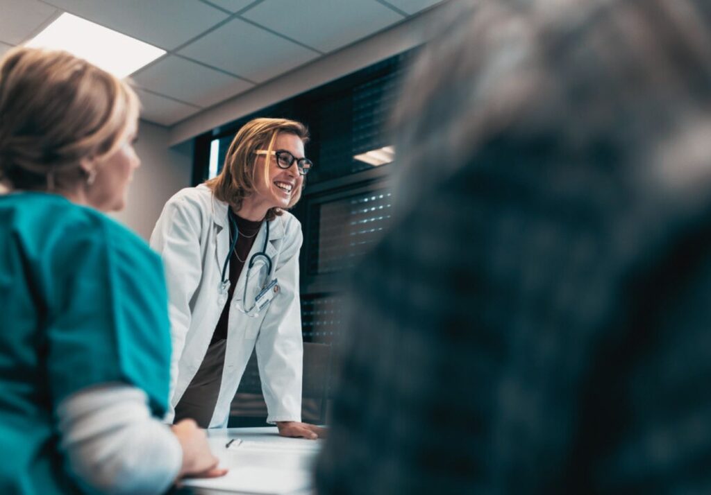 female doctor having a discussion with physicians